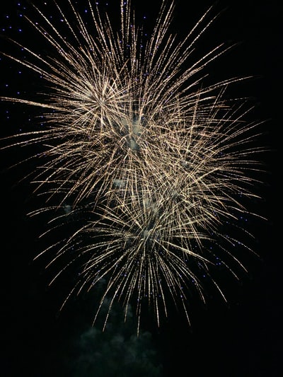 A white fireworks in the sky at night

